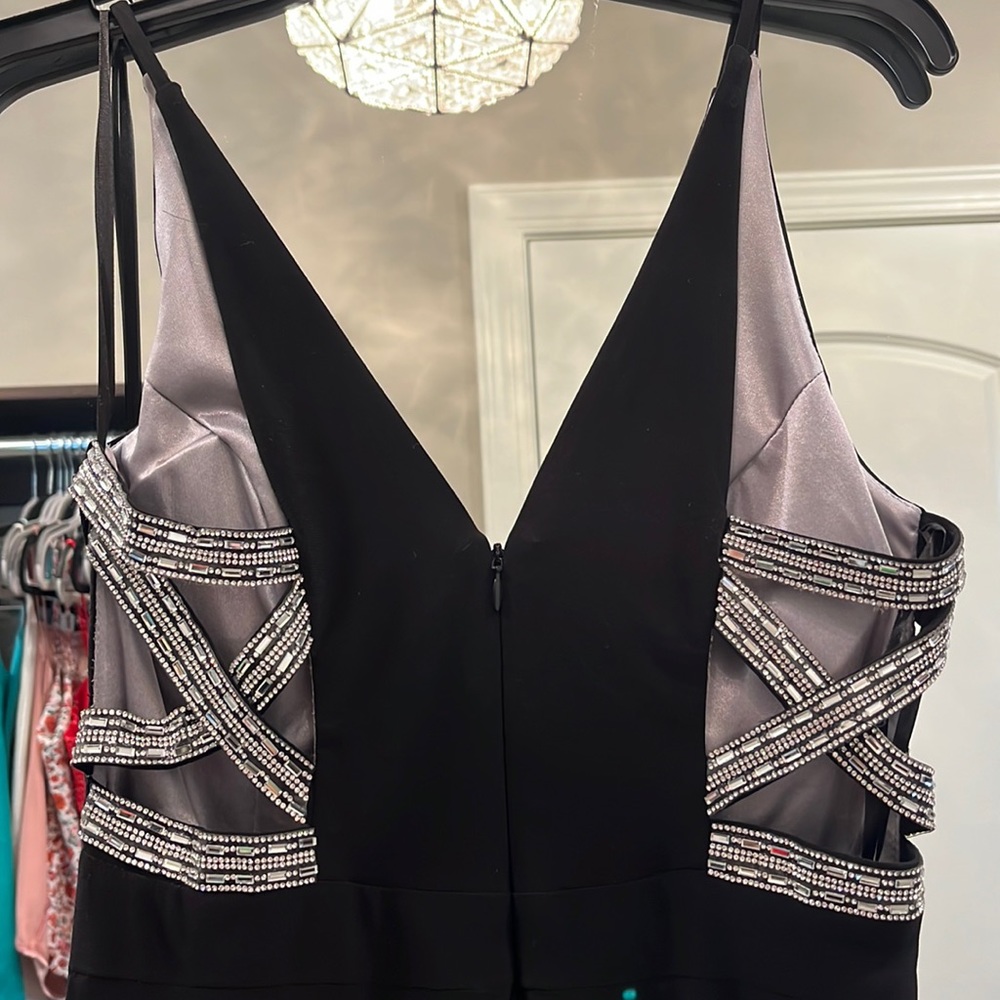 XSCAPE Black long formal dress with rhinestone side panels with slit. Size 6